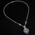 Elegant silver purple floral color zirconium necklace with cascading pendant adorned by yellow gemstones and diamonds