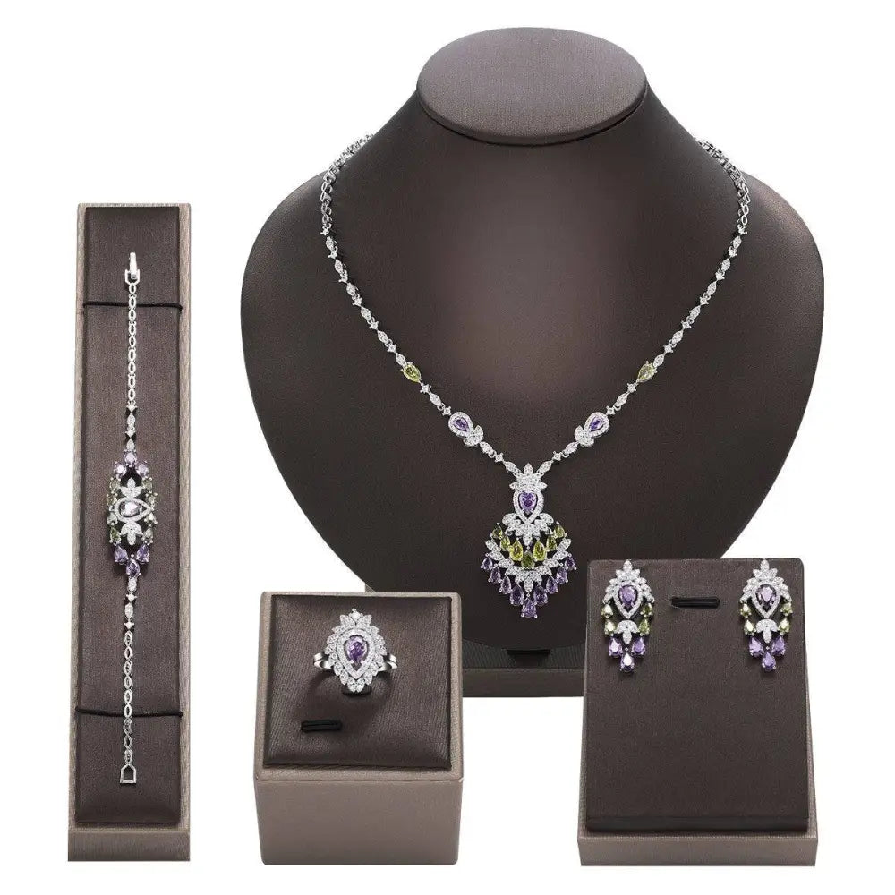 Elegant silver-toned purple floral color zirconium necklace earrings set with matching ring and bracelet featuring gemstones