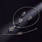 Elegant silver-toned purple floral color zirconium necklace earrings set with green and purple gemstone accents