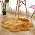 Purple floral shape artificial woolen carpet features a golden faux fur rug with plush texture and irregular edges