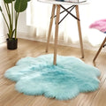 A fluffy light blue floral shape artificial woolen carpet rug with soft faux fur texture perfect for decor