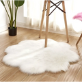 White fluffy sheepskin style rug resembling cloud shape for purple floral shape artificial woolen carpet collection