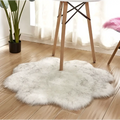 Purple floral shape artificial woolen carpet rug with fluffy white faux fur and subtle gray speckles in cloud-like shape