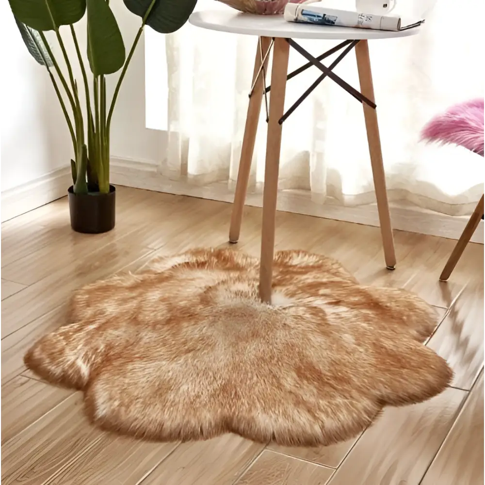 A fluffy golden-brown artificial woolen carpet rug with irregular edges complementing the purple floral shape design