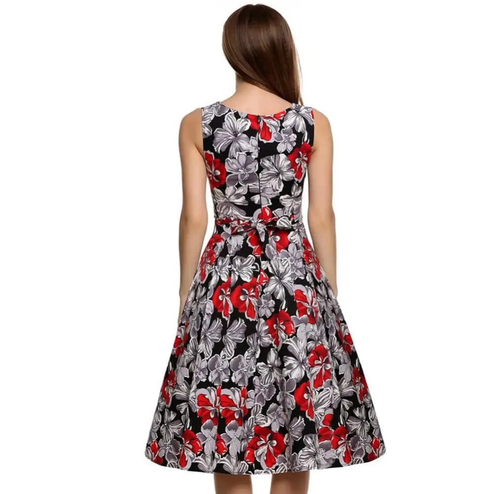 Purple floral sleeveless vintage print dress in black with red and silver floral pattern and fitted waist belt