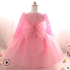 Back view of purple lace girls dress rose wedding dress featuring pink lace and a large bow at the back