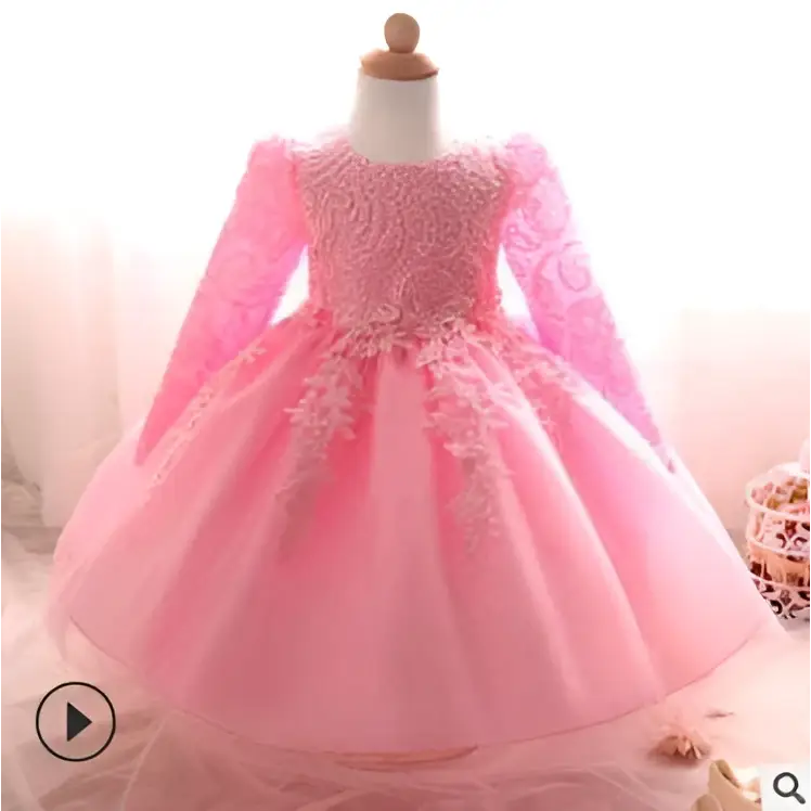 A delicate pink purple lace girls dress rose wedding dress with long sleeves lace detailing and flowing tulle skirt