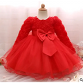 A vibrant red long-sleeved toddler dress with fluffy texture and layered tulle skirt for rose wedding dress use