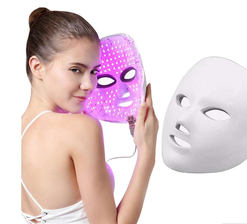 A purple led light therapy face mask with a grid of glowing dots and an attached power cord featured among the best gadgets and tech accessories for 2026.