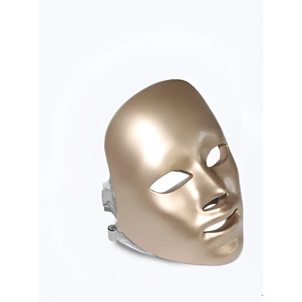 Gold-colored sleek purple led mask facial beauty device with smooth metallic finish and precise cutouts for fine lines treatment