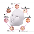 White facial mask with cutouts designed for the purple led mask facial beauty device to reduce fine lines