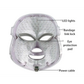 Clear plastic purple led mask with embedded lights and gray silicone eye pads for fine lines facial beauty device
