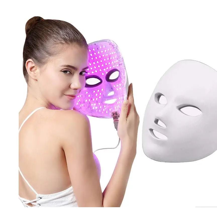 Purple led mask facial beauty device with glowing dot grid and power cord designed to reduce fine lines and improve skin