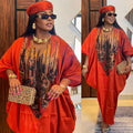 A vibrant orange satin kaftan with gold and black floral embroidery paired with a matching red headwrap and purple patterned ethnic style loose plus size dress