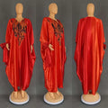 Vibrant red satin kaftan with intricate black embroidery paired with purple patterned ethnic style loose plus size dress
