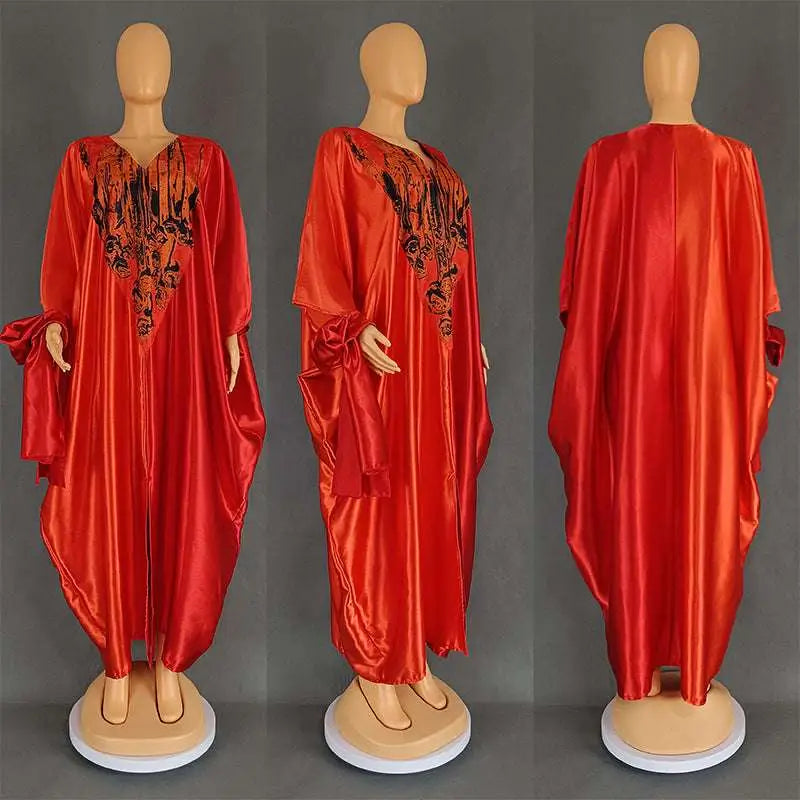 Vibrant red satin kaftan with intricate black embroidery paired with purple patterned ethnic style loose plus size dress