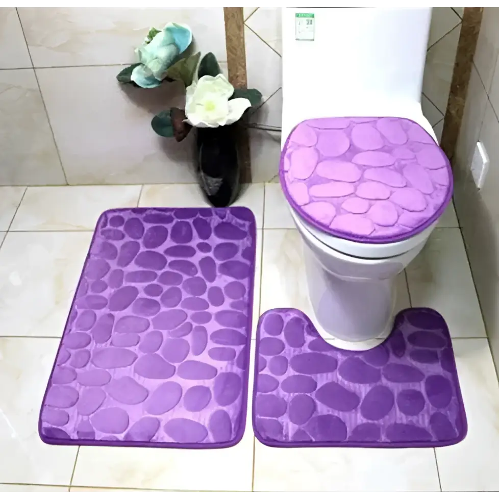 Purple pebble 3 piece bathroom rug set with toilet lid cover featuring pebble-patterned purple fabric for bathroom use