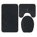Black pebble textured bathroom rug set featuring toilet lid cover from the purple pebble 3 piece set