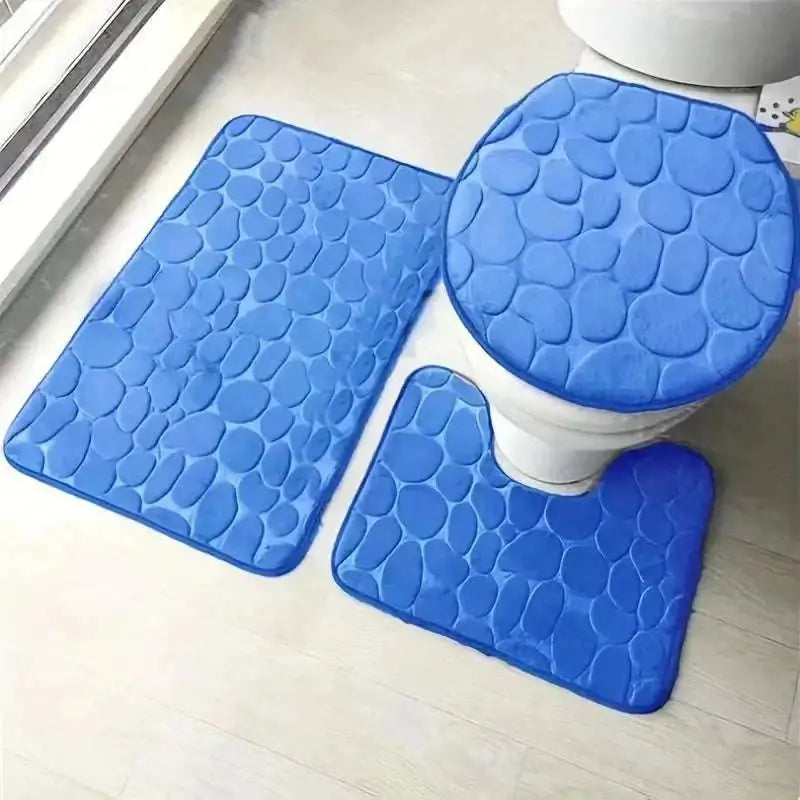 Purple pebble 3 piece bathroom rug set with blue pebble textured toilet lid cover and matching mats
