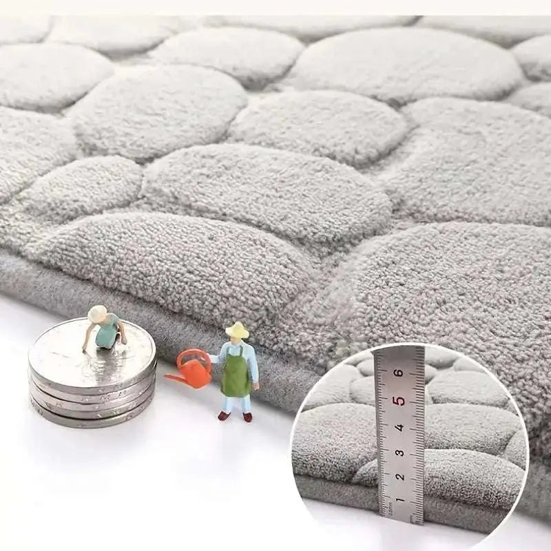Gray plush circularly quilted bathroom rug set piece from purple pebble with a soft textured surface for comfort