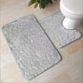 Gray pebble textured bath mat from purple pebble 3 piece bathroom rug set with toilet lid cover included