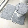 Gray pebble textured three piece bathroom rug set including toilet lid cover for purple pebble collection