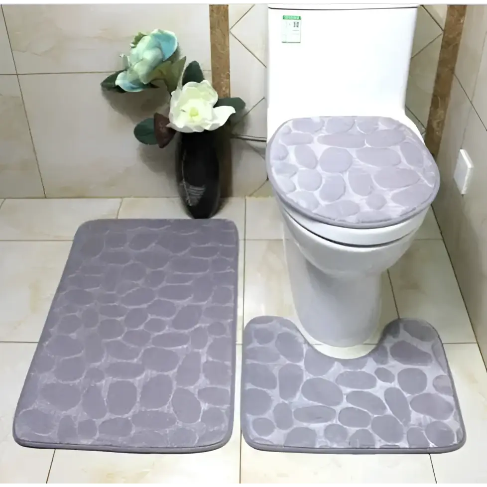 Gray pebble-patterned bathroom rug set including toilet lid cover from the purple pebble 3 piece collection