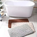 Purple pebble bathroom rug set with three textured pebble pattern mats in brown beige and gray for bathroom use