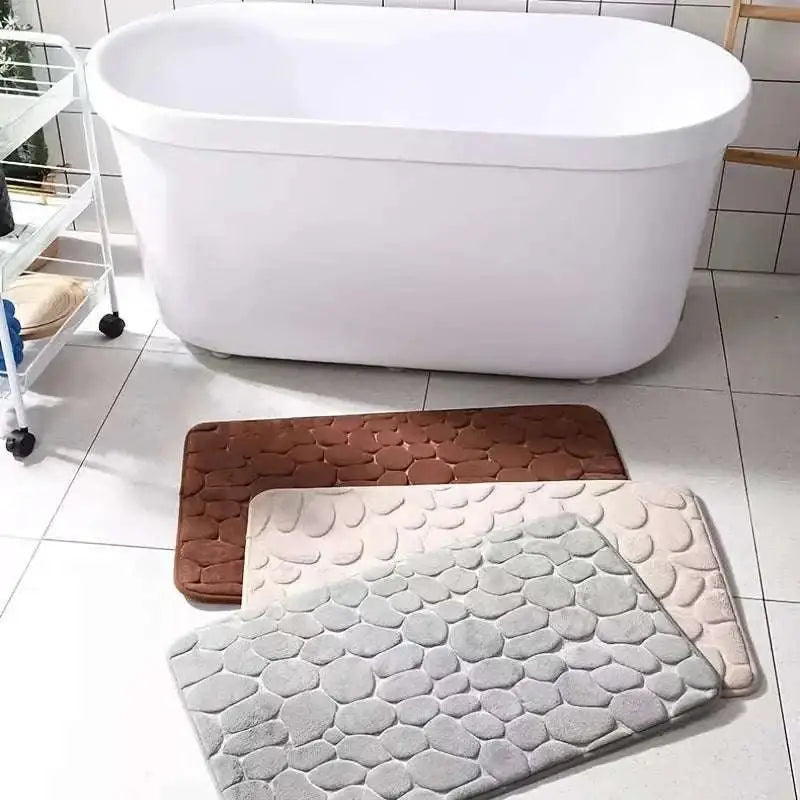 Purple pebble bathroom rug set with three textured pebble pattern mats in brown beige and gray for bathroom use