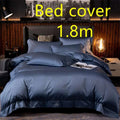 Deep navy blue satin embroidered bed cover with subtle sheen in a purple satin embroidered four-piece bed sheet set