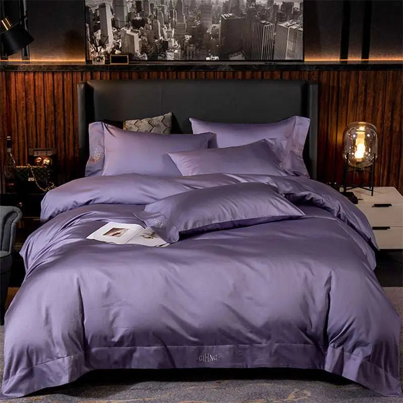 Purple satin embroidered four-piece bed sheet set with subtle pillowcase embroidery and satin fabric main component