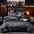 Dark gray satin embroidered duvet cover set with subtle branding corner detail in purple satin embroidered four-piece fabric main component