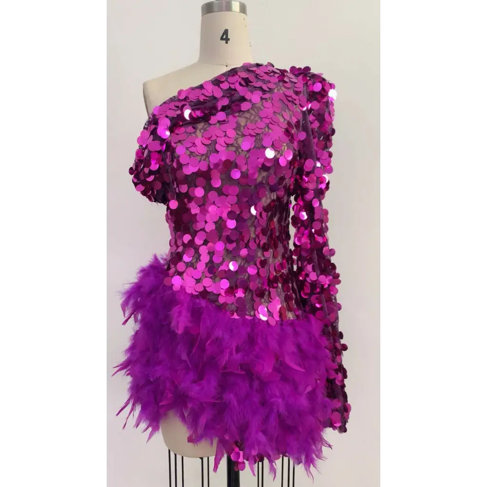 A vibrant purple sequined feather sleeve short dress with one-shoulder design and feather embellishments