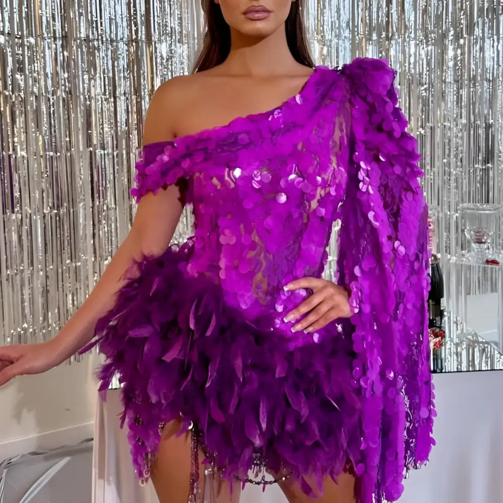 A vibrant purple sequined feather sleeve short dress with one-shoulder design and feather embellishments