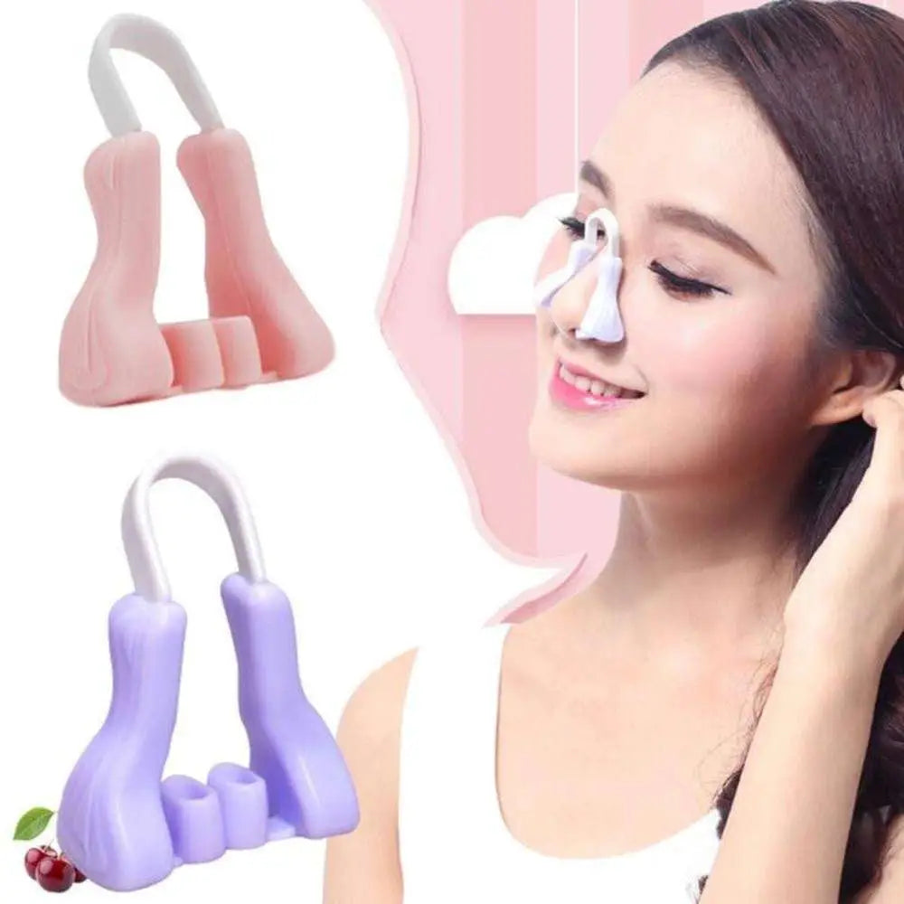 Purple silicone nose reshaping clip with pink and purple u-shaped silicone and white plastic handle beauty device