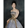 Purple tube embossed toast dress with a shimmering silver and gold sequined strapless ball gown design and voluminous skirt
