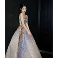 Purple tube embossed toast dress featuring a shimmering strapless ball gown with gold sequined gradient detailing