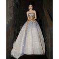 Purple tube embossed toast dress with a strapless gold sequined bodice and flowing silver to lavender skirt with sequins