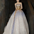 Strapless purple tube embossed toast dress with a gold sequined bodice and lavender white glittery voluminous skirt