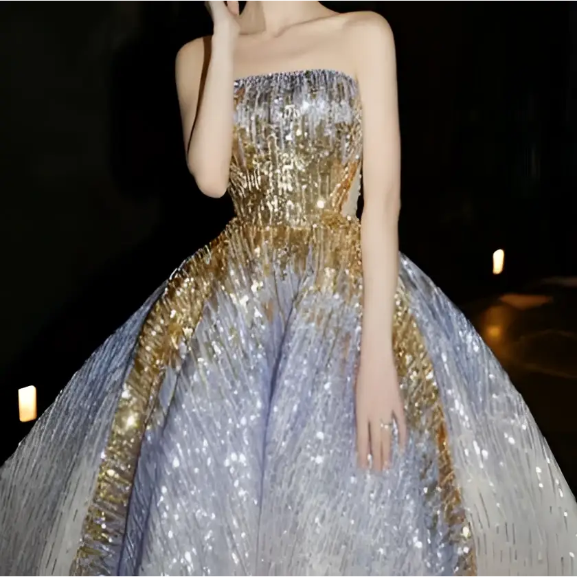 Shimmering silver and gold sequined ball gown with strapless bodice and voluminous skirt in purple tube embossed toast dress