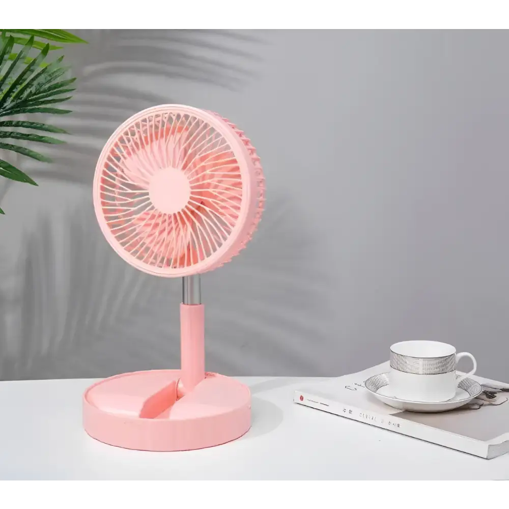 Pink portable telescopic folding fan with sleek modern design features a circular head and slender stand for quiet use