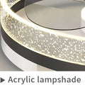 Quiet simple modern nordic circular ceiling fan lamp with black and white frame and acrylic glitter diffuser emitting warm light