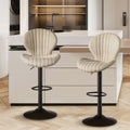 Quilted cream velvet upholstered bar stool with black metal base and footrest offering luxury women’s fashion comfort