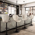 Quilted cream velvet upholstered bar stools with sleek black metal base and adjustable height for luxury women’s fashion settings