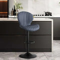 Blue velvet bar stool with sleek black metal base and adjustable height complementing quilted cream velvet style