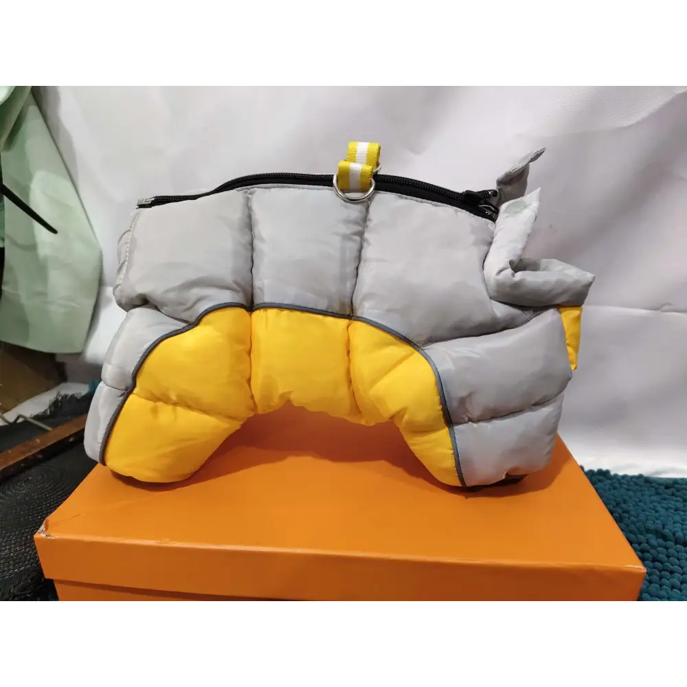 Quilted orange and white pet dog winter clothes with a puffy gray and yellow coat featuring black zipper and silver hardware