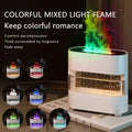 White cylindrical rain cloud humidifier drip aroma diffuser with transparent glass panels and gold accents emitting colorful light flame effect