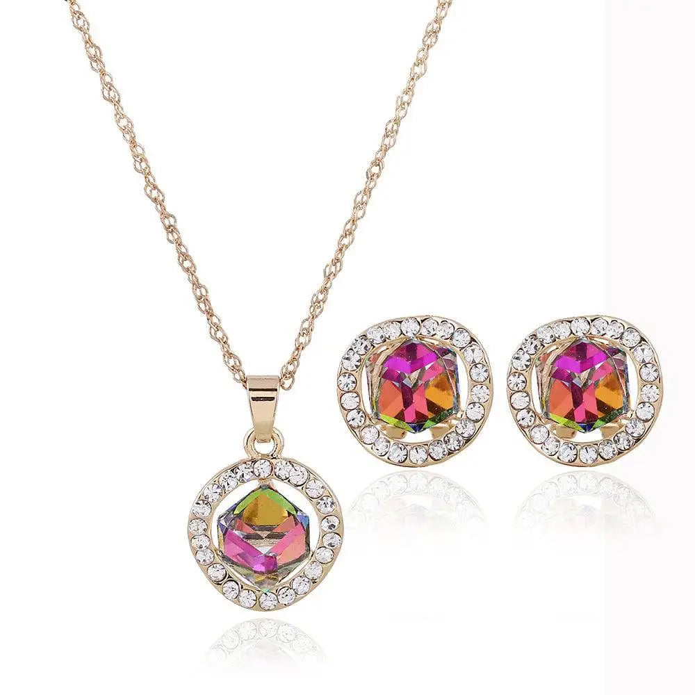 Gold-toned rainbow crystal bridal earrings set and crystal bridal necklace with central rainbow crystal and clear rhinestones