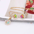 Gold-toned rainbow crystal bridal necklace and earrings set featuring central rainbow crystals with clear rhinestone halos