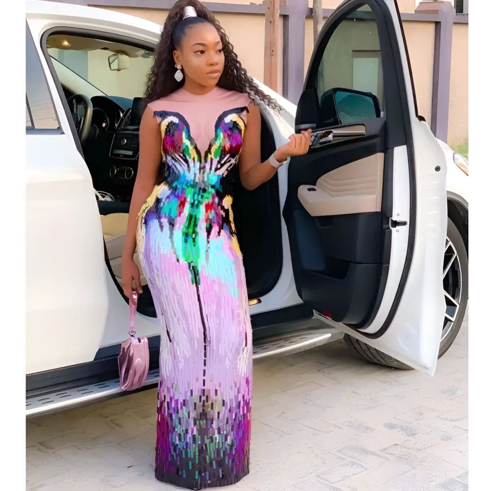 A shimmering long sleeved rainbow gradient sequin evening dress for female singer costume in pink to purple hues